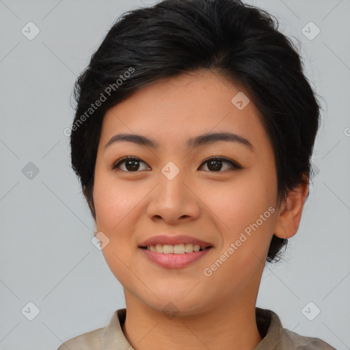 Joyful asian young-adult female with short  black hair and brown eyes