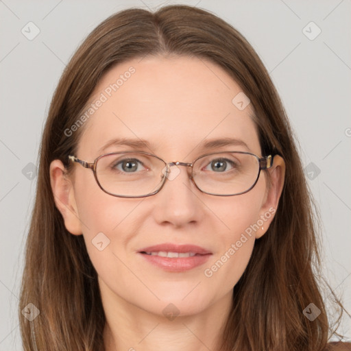 Joyful white adult female with long  brown hair and grey eyes