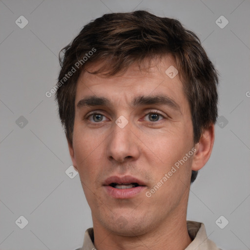 Neutral white adult male with short  brown hair and brown eyes