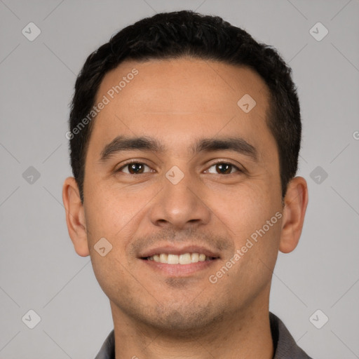 Joyful white young-adult male with short  black hair and brown eyes