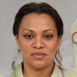 Joyful white adult female with medium  brown hair and brown eyes