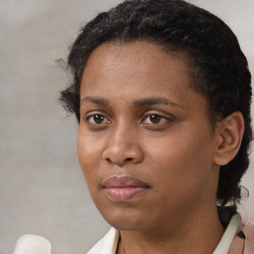 Neutral black young-adult female with short  black hair and brown eyes