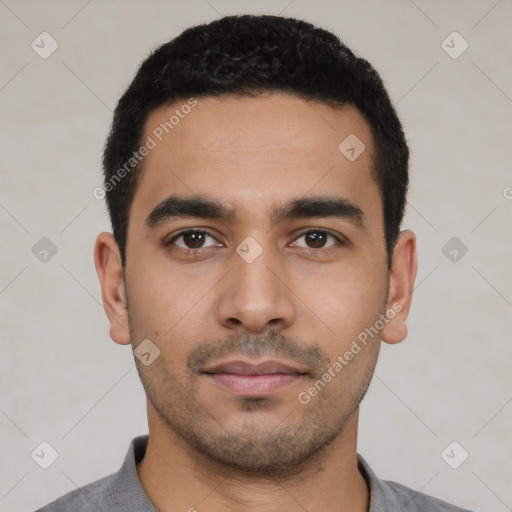 Neutral latino young-adult male with short  black hair and brown eyes