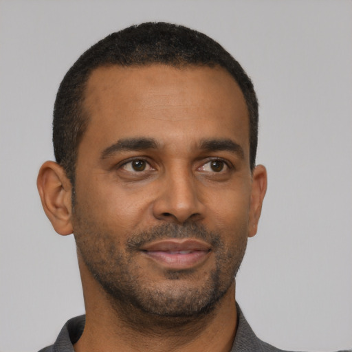 Neutral black young-adult male with short  black hair and brown eyes