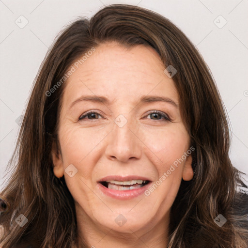 Joyful white adult female with long  brown hair and brown eyes