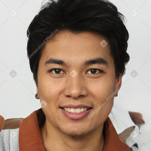 Joyful asian young-adult male with short  black hair and brown eyes