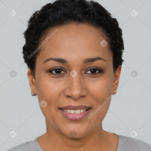 Joyful black young-adult female with short  black hair and brown eyes