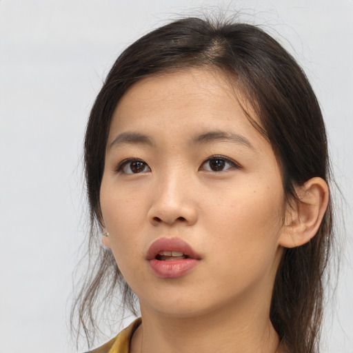 Neutral asian young-adult female with medium  brown hair and brown eyes