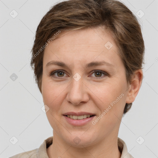 Joyful white adult female with short  brown hair and grey eyes