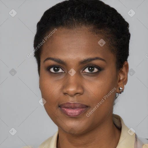 Joyful black young-adult female with short  brown hair and brown eyes