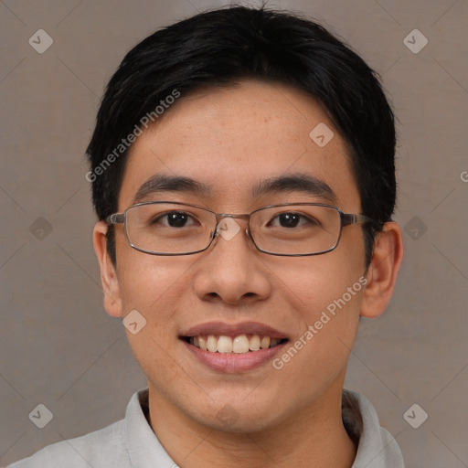 Joyful asian young-adult male with short  black hair and brown eyes