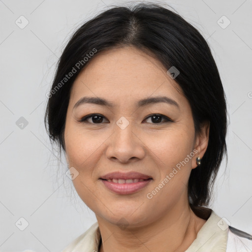 Joyful asian young-adult female with medium  black hair and brown eyes