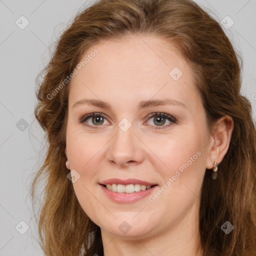 Joyful white young-adult female with long  brown hair and green eyes