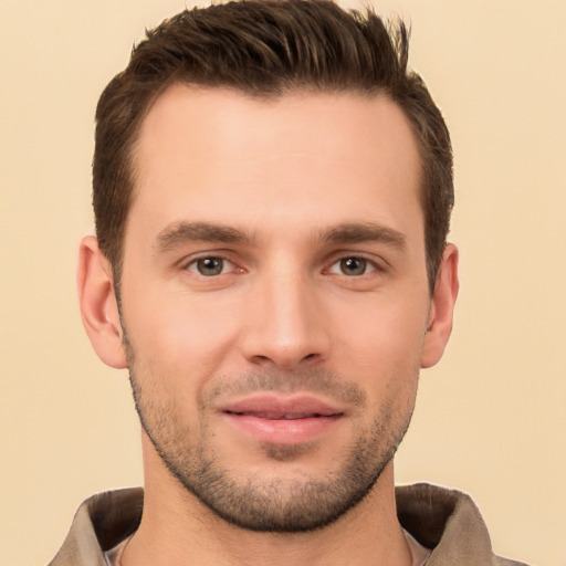 Joyful white young-adult male with short  brown hair and brown eyes