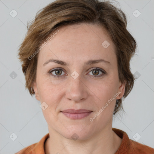 Joyful white adult female with medium  brown hair and grey eyes