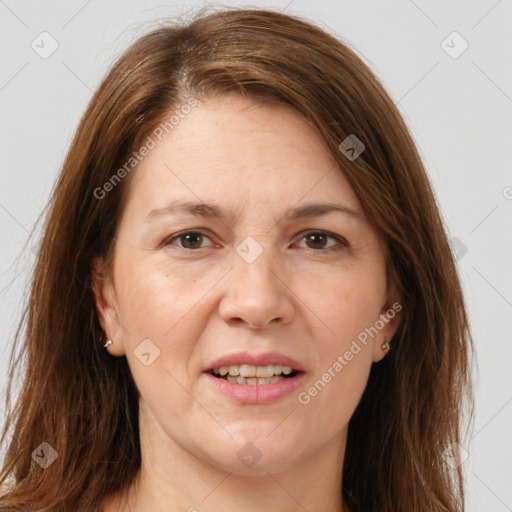 Joyful white adult female with long  brown hair and brown eyes