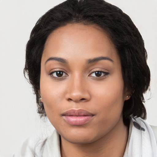 Joyful latino young-adult female with medium  black hair and brown eyes