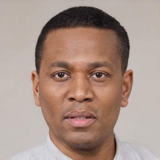 Neutral latino adult male with short  black hair and brown eyes