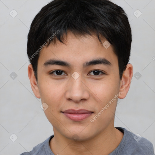 Joyful asian young-adult male with short  brown hair and brown eyes