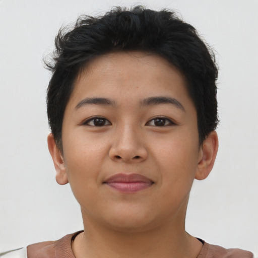 Joyful asian young-adult female with short  brown hair and brown eyes