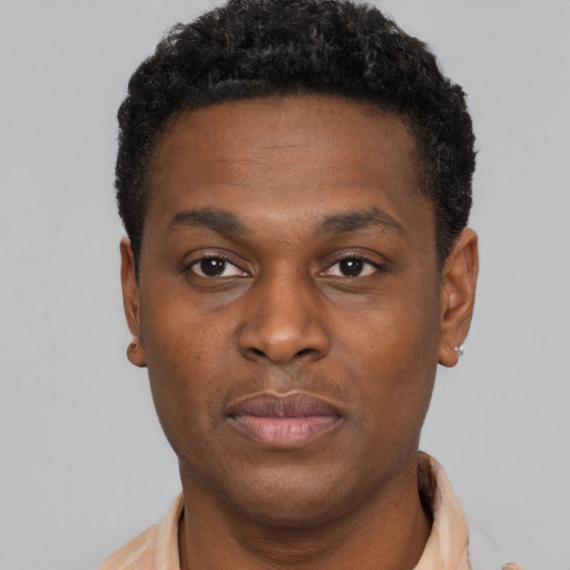 Neutral black young-adult male with short  brown hair and brown eyes