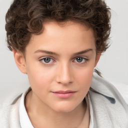 Joyful white child female with short  brown hair and brown eyes