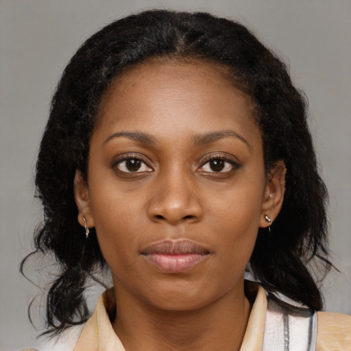 Neutral black young-adult female with medium  brown hair and brown eyes