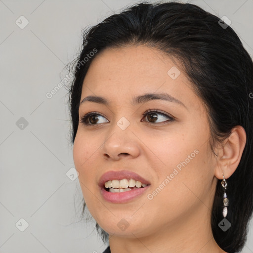 Joyful asian young-adult female with long  brown hair and brown eyes