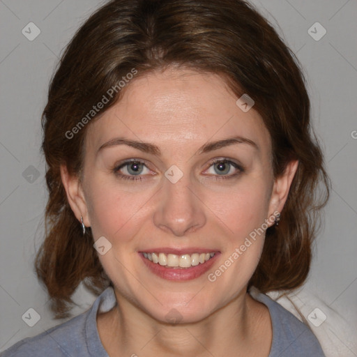 Joyful white young-adult female with medium  brown hair and blue eyes