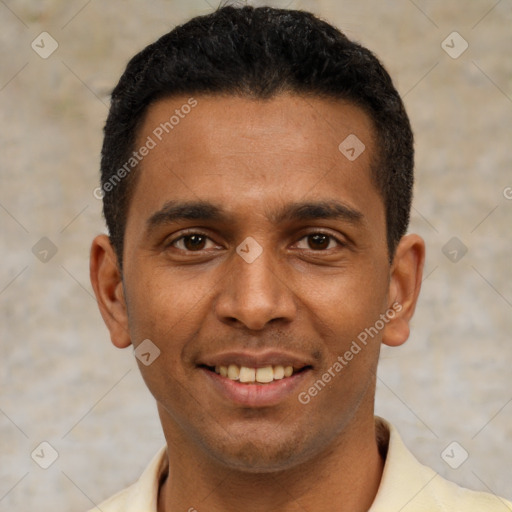 Joyful latino young-adult male with short  black hair and brown eyes