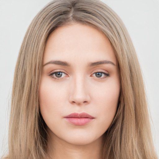 Neutral white young-adult female with long  brown hair and brown eyes