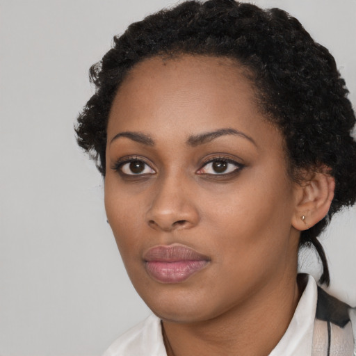 Neutral black young-adult female with short  black hair and brown eyes