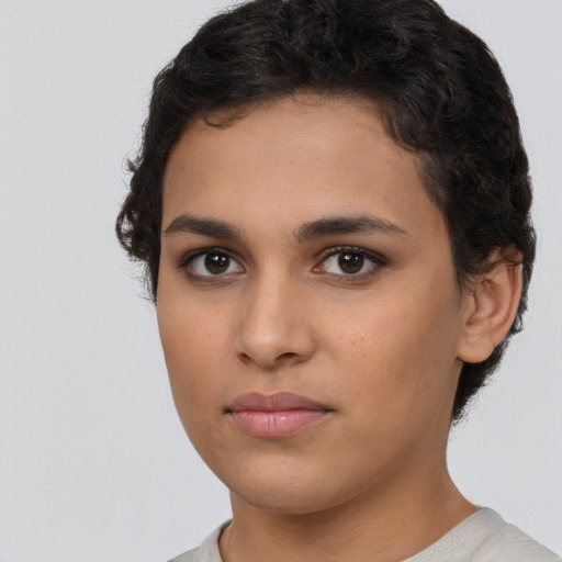 Neutral latino young-adult female with short  brown hair and brown eyes