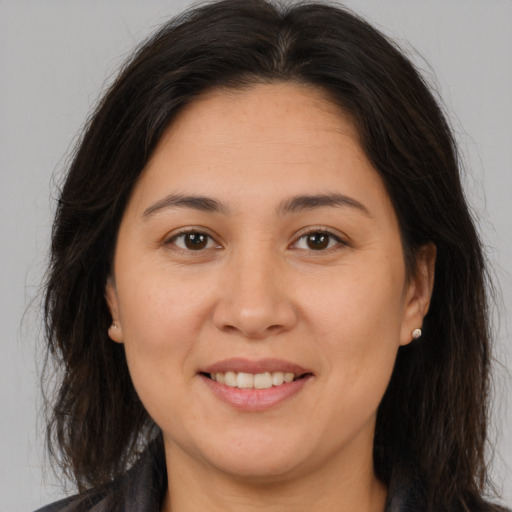 Joyful white young-adult female with medium  brown hair and brown eyes