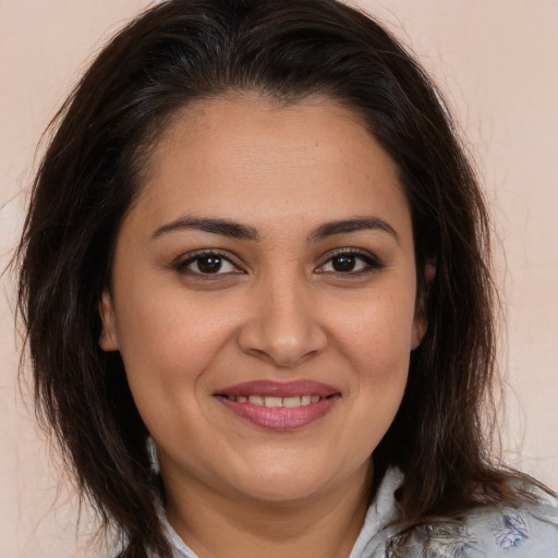 Joyful white young-adult female with medium  brown hair and brown eyes