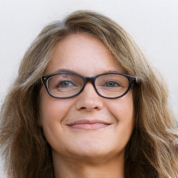 Joyful white adult female with long  brown hair and grey eyes