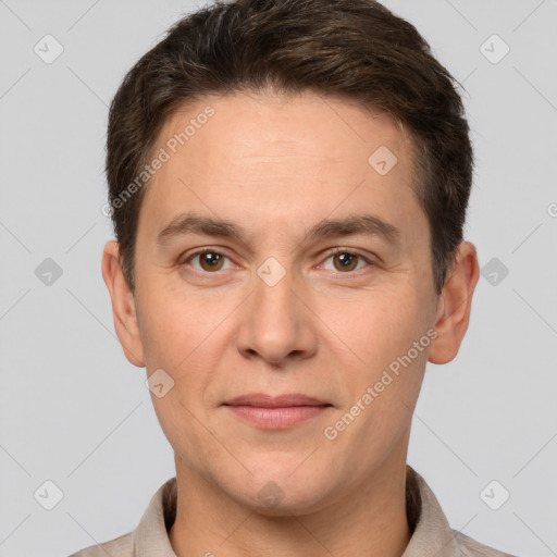 Joyful white adult male with short  brown hair and brown eyes