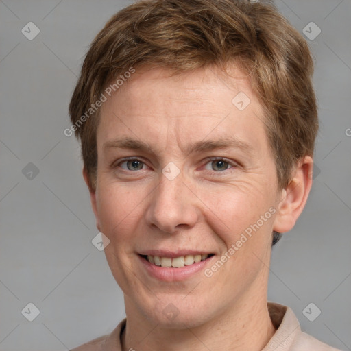 Joyful white adult male with short  brown hair and grey eyes