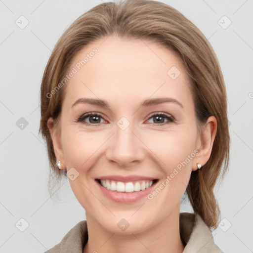 Joyful white young-adult female with medium  brown hair and grey eyes