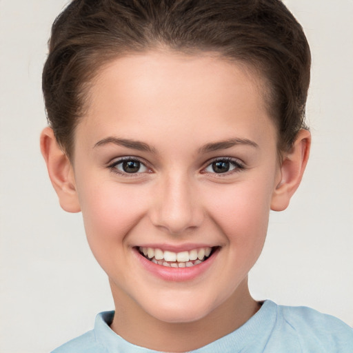 Joyful white child female with short  brown hair and brown eyes