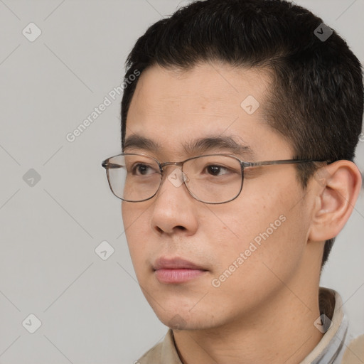 Neutral white young-adult male with short  black hair and brown eyes