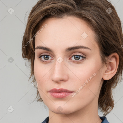 Neutral white young-adult female with medium  brown hair and grey eyes