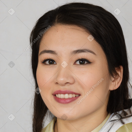 Joyful asian young-adult female with medium  brown hair and brown eyes