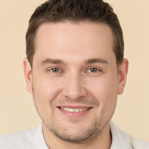 Joyful white adult male with short  brown hair and brown eyes