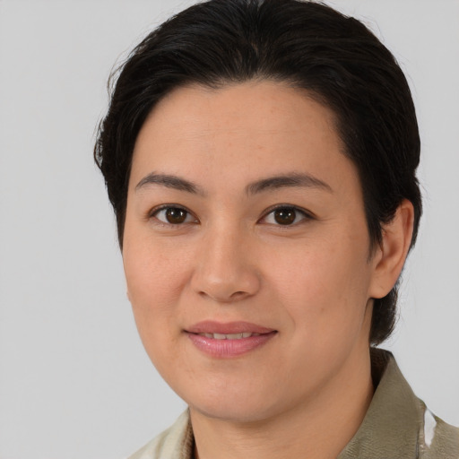 Joyful asian young-adult female with medium  brown hair and brown eyes