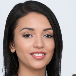 Joyful white young-adult female with long  black hair and brown eyes