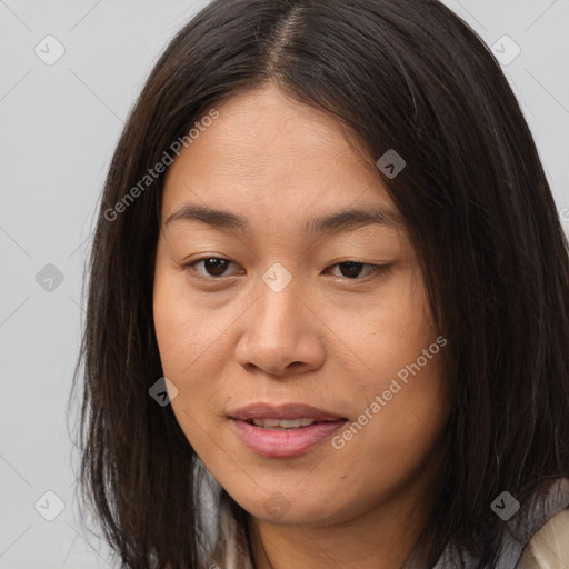 Joyful asian young-adult female with long  brown hair and brown eyes