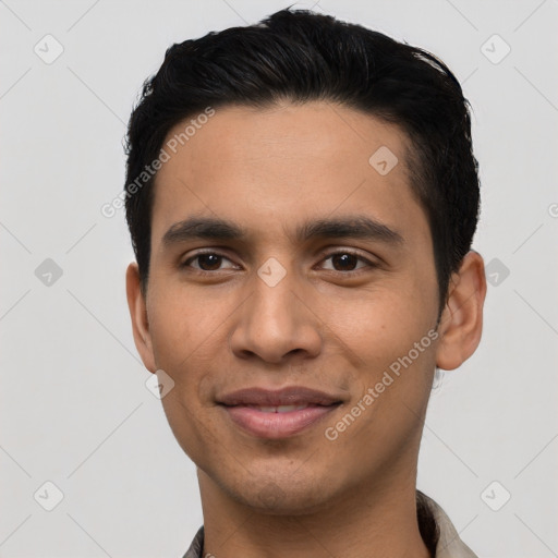 Joyful latino young-adult male with short  black hair and brown eyes