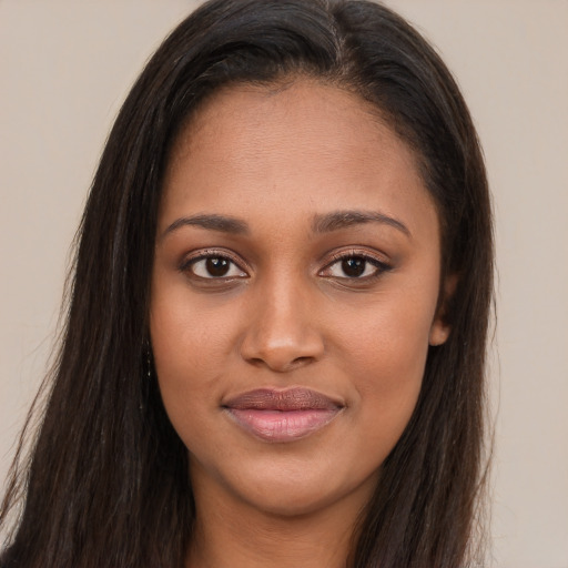 Joyful asian young-adult female with long  brown hair and brown eyes