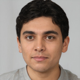 Neutral white young-adult male with short  black hair and brown eyes